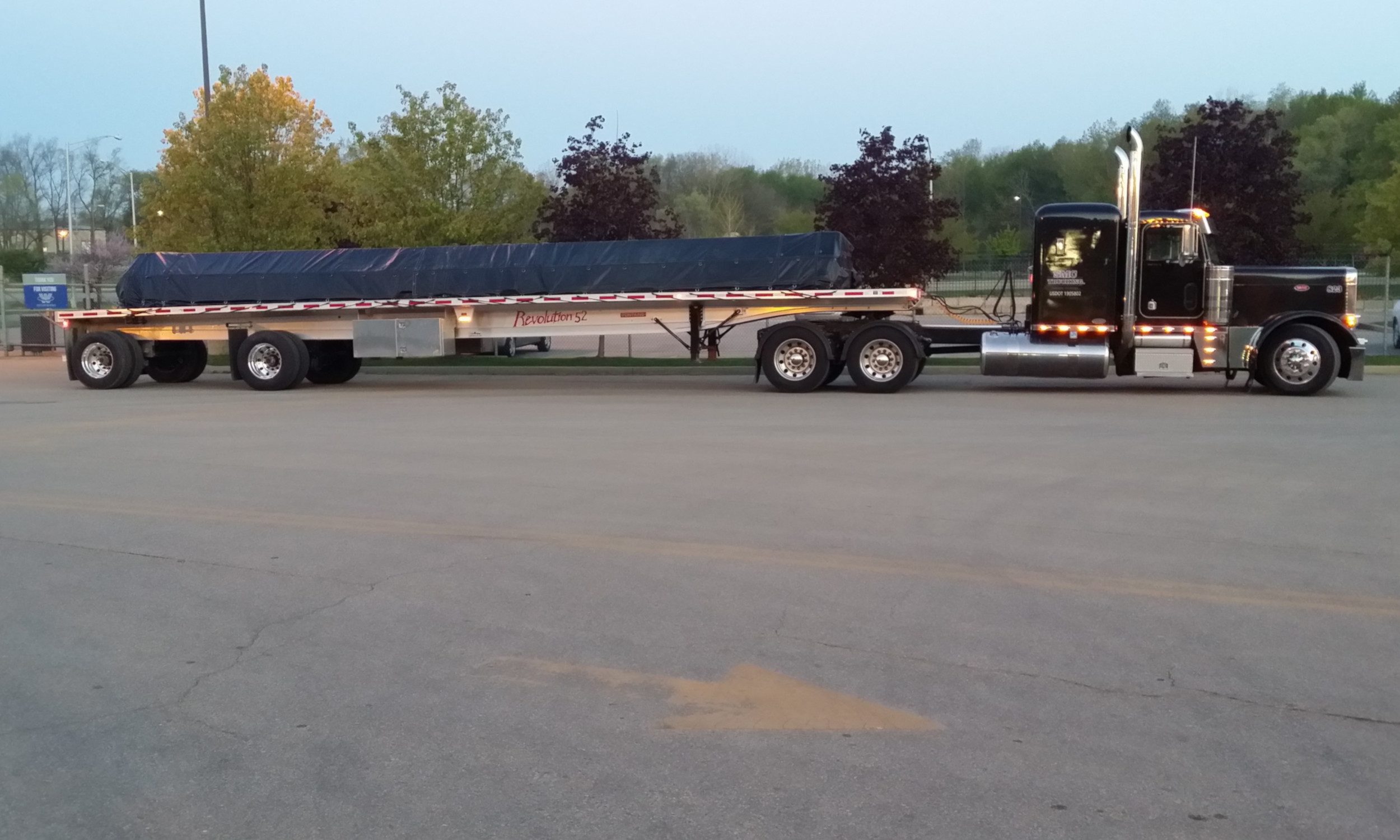 Black Peterbilt Fontaine Flatbed Tarped